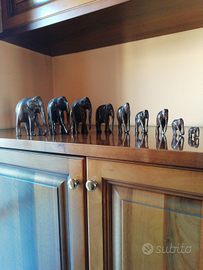 9 elefantini di legno usati ma ben conservati