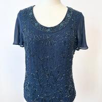 Top elegante in voille blu