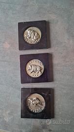 medaglie raffiguranti stagioni opera Minguzzi