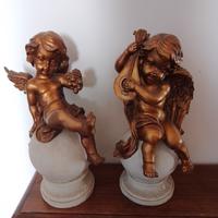 coppia di putti dorati