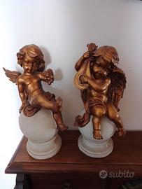 coppia di putti dorati