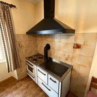 Cucina a legna con cappa piano elettrico  e forno