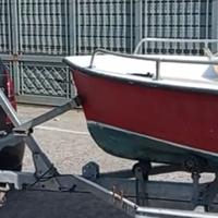 piccola barca ,motore,più carrello.