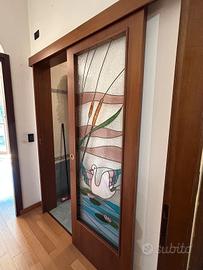 porta scorrevole esterna con vetrata