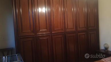 camera con armadio stagionale 6 ante in noce