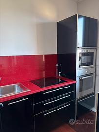 CUCINA IN MARMO ROSSO CON ISOLA