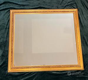 SPECCHIO CON CORNICE IN ORO ANTICHIZZATO