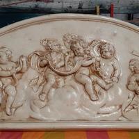 altorilievo in gesso di "putti"
