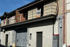 Appartamento al piano terra e sottotetto grezzo