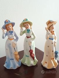 Tris statuine vintage dame con ombrello