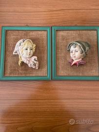 Due maschere in porcellana su iuta anni 50