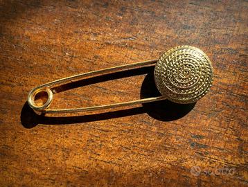 Spillone vintage in metallo dorato