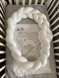 Riduttore / paracolpi per culla