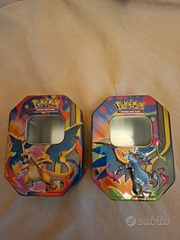Due tin Charizard Megaevoluzione vuote