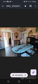 Tavolo da pranzo ovale con piano in vetro