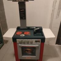 Cucina Miele con accessori e carrello della spesa