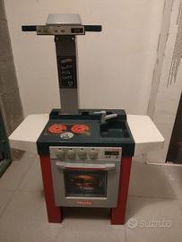 Cucina Miele con accessori e carrello della spesa