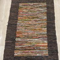 Tappeto in pelle intrecciata