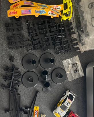Lotto accessori e macchinine per pista Artin 1:43