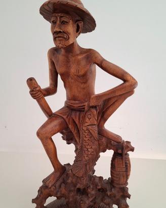 Scultura in legno intagliato pescatore con pesce
