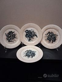 Serie di 4 piatti da dolce in ceramica decorata