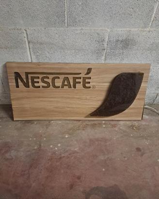 Insegna Nescafè luminosa