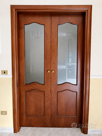 Porta scorrevole doppia esterna a muro in legno
