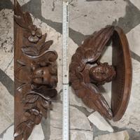 antichi putti alati in legno intaglisto