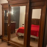 Camera da letto in legno in stile completa