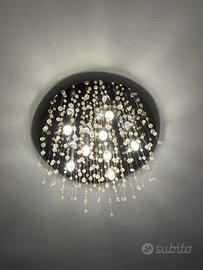 Lampadario moderno in acciaio e vetro