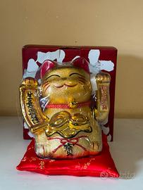 Gatto dorato porta fortuna