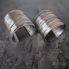 Coppia Bracciali Rigidi regolabili a Molla 