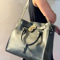 Borsa Michael Kors verde scuro e oro