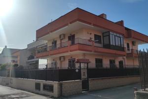 Trilocale con Terrazzo Perimetrale e Box Auto