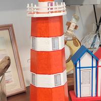 Faro decorativo fatto a mano arancione e bianco