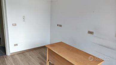 Stanza in studio medico in condivisione