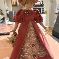 Bambola d’epoca in vestito rosa