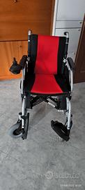 Sedia a rotelle elettrica