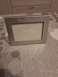 Cornice Renato Balestra in metallo