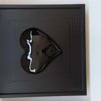 Heart in frame. cuore nero in cornice in legno col