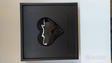 Heart in frame. cuore nero in cornice in legno col