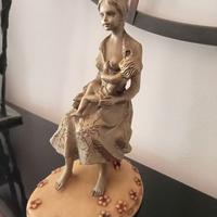 Scultura in peltro, cesellata e decorata a mano