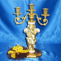 Candeliere dorato due puttini