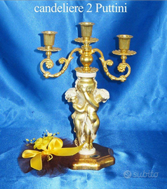 Candeliere dorato due puttini