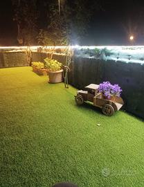 Casa bilocale con giardino e garage