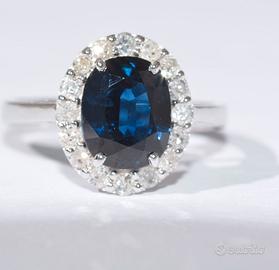 Anello Oro 18kt con 16 diamanti bianchi e Zaffiro