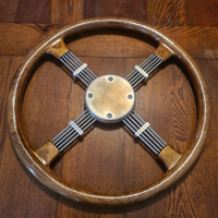 Volante a croce artigianale in acciaio tornito