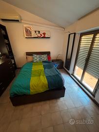 Camera da letto con letto contenitore 1/2 piazza