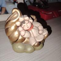 thun Angelo disteso su nuvola 