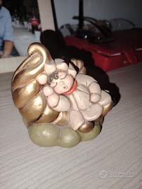 thun Angelo disteso su nuvola 